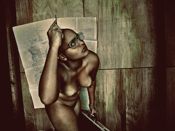 High-contrast photograph depicting a nude figure facing toward the camera.