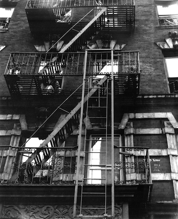 Black and white photograph showing a fire escape.