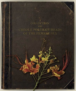 A leather-bound book cover with flowers.