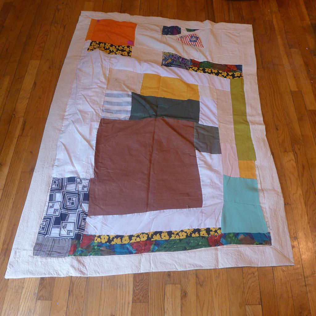"rectangular cloth patchwork piece, multiple colors"