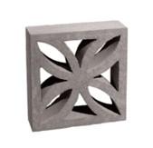 greyscale image of a breeze block with an ornamental petal design